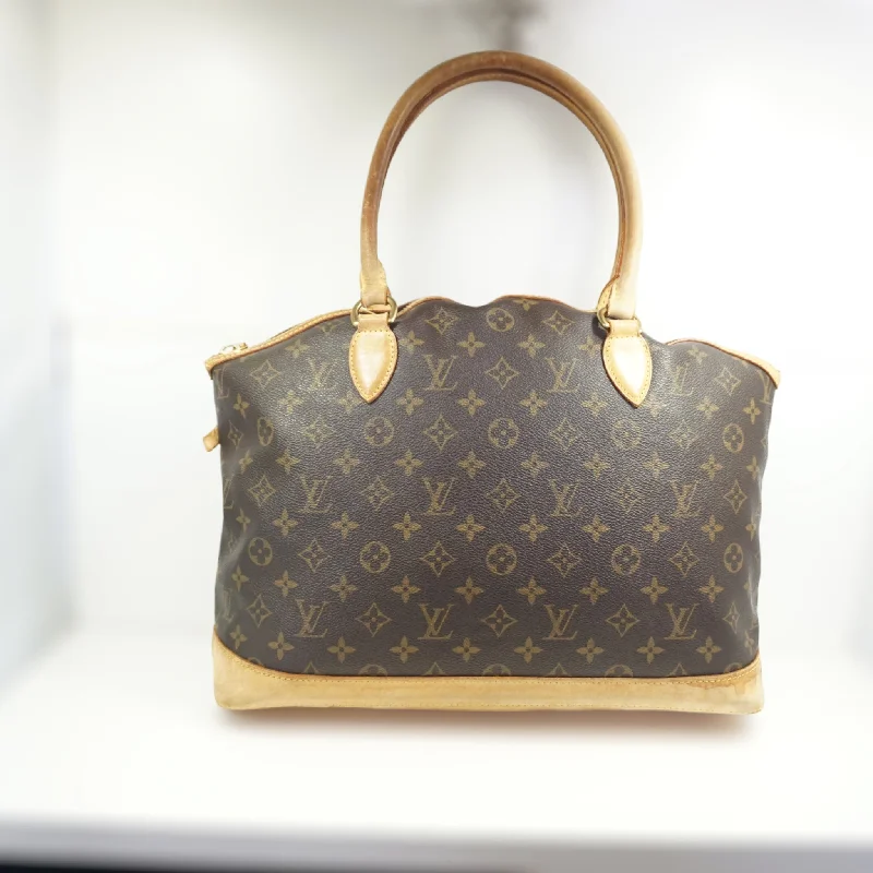 Louis Vuitton bags with a snap - button closure and a decorative charm for styleLouis Vuitton Lock It