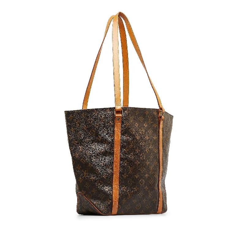 Ladies Louis Vuitton shoulder bags with a tassel decoration for charmBrown Louis Vuitton Monogram Sac Shopping Tote Bag