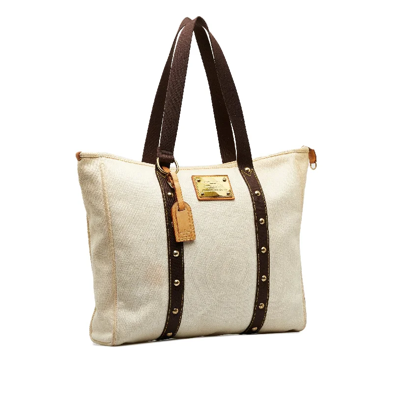 Louis Vuitton crossbody bags with a woven leather strap for textureWhite Louis Vuitton Antigua Cabas GM Tote Bag