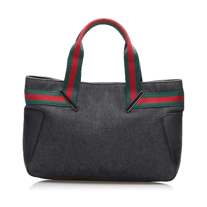 Gucci handbags for women with a metal - framed claspGucci Web Denim Handbag