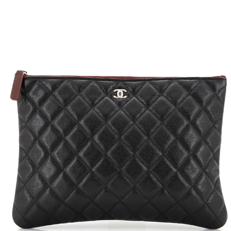 Christian Dior Saddle bags with a studded trim for a bold lookO Case Clutch Quilted Caviar Medium