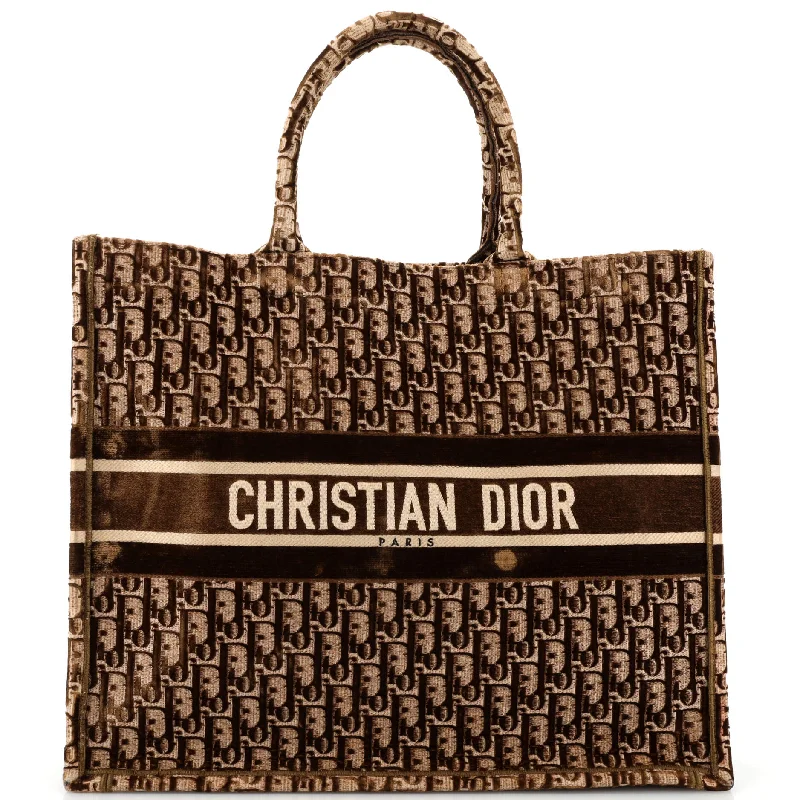 Christian Dior tote bags with a printed Dior logo on the frontBook Tote Oblique Velvet Large